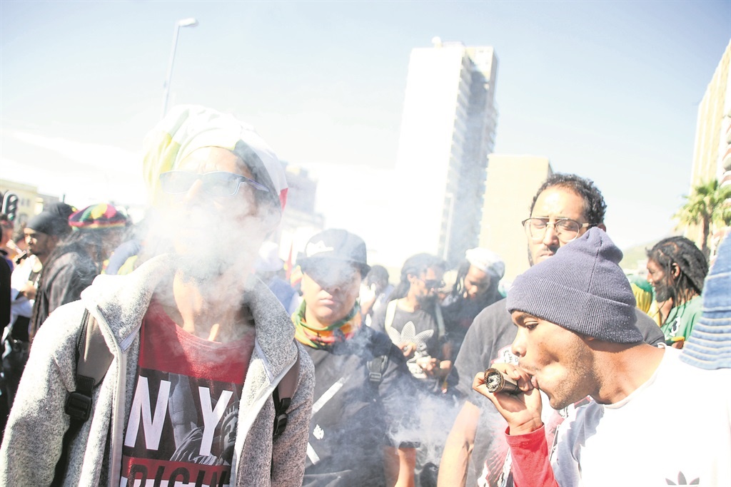 Protesters smoked freely in front of the police during their match on Saturday. Photo by Lindile Mbontsi 