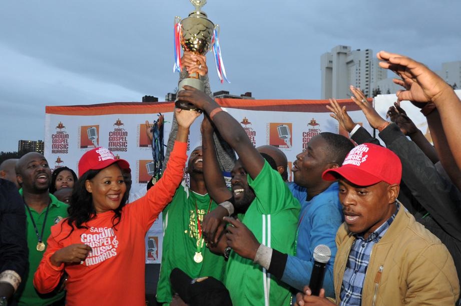 SABC Crown Gospel Awards founder Zanele LaMbokazi-Nkambule giving pastors a trophy after they won the soccer match against gospel artists.
Photo: Jabulani Langa