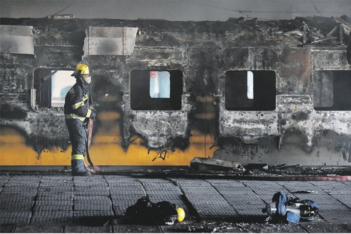 One of the many trains that have been torched and vandalised in the Western Cape. Pictures: Jonathan Lestrade / Die Son