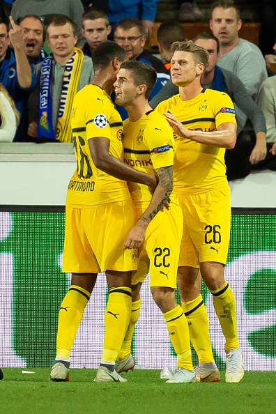 Christian Pulisic of Borussia Dortmund celebrates after scoring his team`s first goal with team mates during the UEFA Champions League Group A match between Club Brugge and Borussia Dortmund 