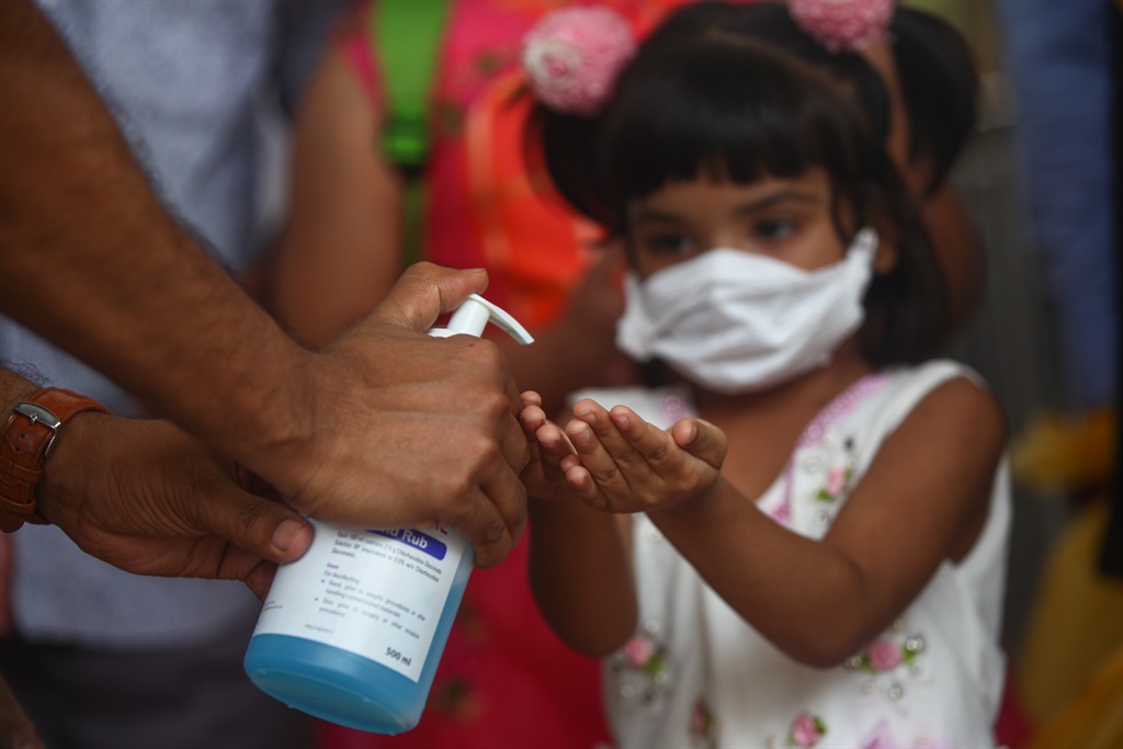 Bangladeshi child patient wears face masks to prot