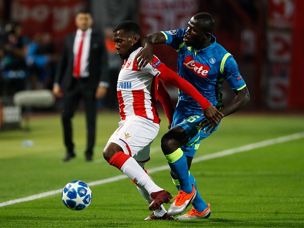 El Fardou Ben Nabouhane (L) of Crvena Zvezda is challenged by Kalidou Koulibaly (R) of SSC Napoli during the Group C match of the UEFA Champions League between Crvena Zvezda Belgrade and SSC Napoli