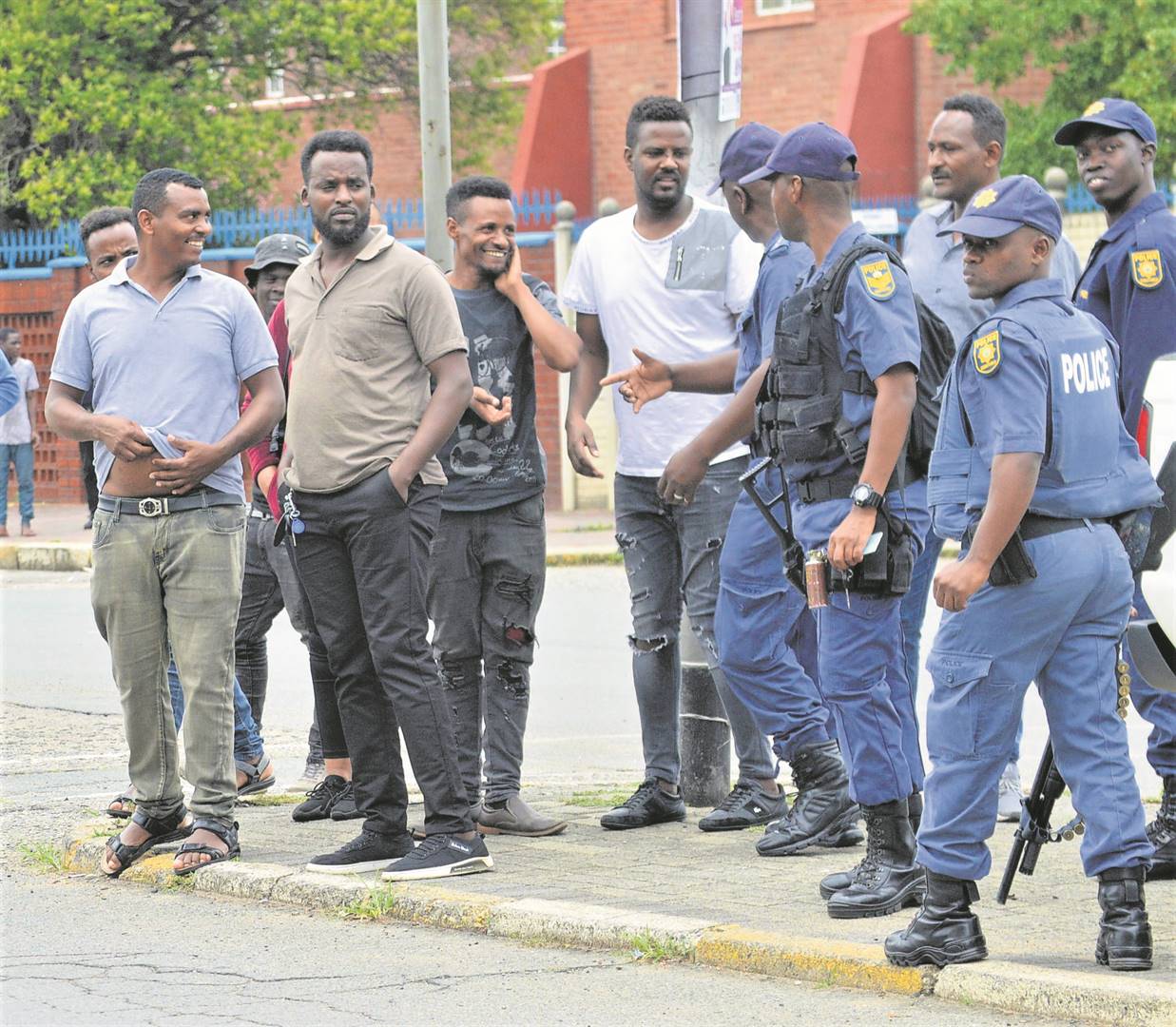 Foreign shop owners stormed the Vereeniging Police Station demanding their money and cigarettes back. Inset: illicit cigarette boxes that police seized during a raid at a shop in Vereeeniging, in the Vaal.                                 Photo by Tumelo Mofokeng