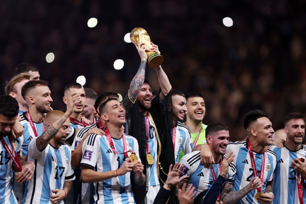 LUSAIL CITY, QATAR - DECEMBER 18: Lionel Messi of Argentina lifts the FIFA World Cup Qatar 2022 Winners Trophy following the FIFA World Cup Qatar 2022 Final match between Argentina and France at Lusail Stadium on December 18, 2022 in Lusail City, Qatar. (Photo by Clive Brunskill/Getty Images)