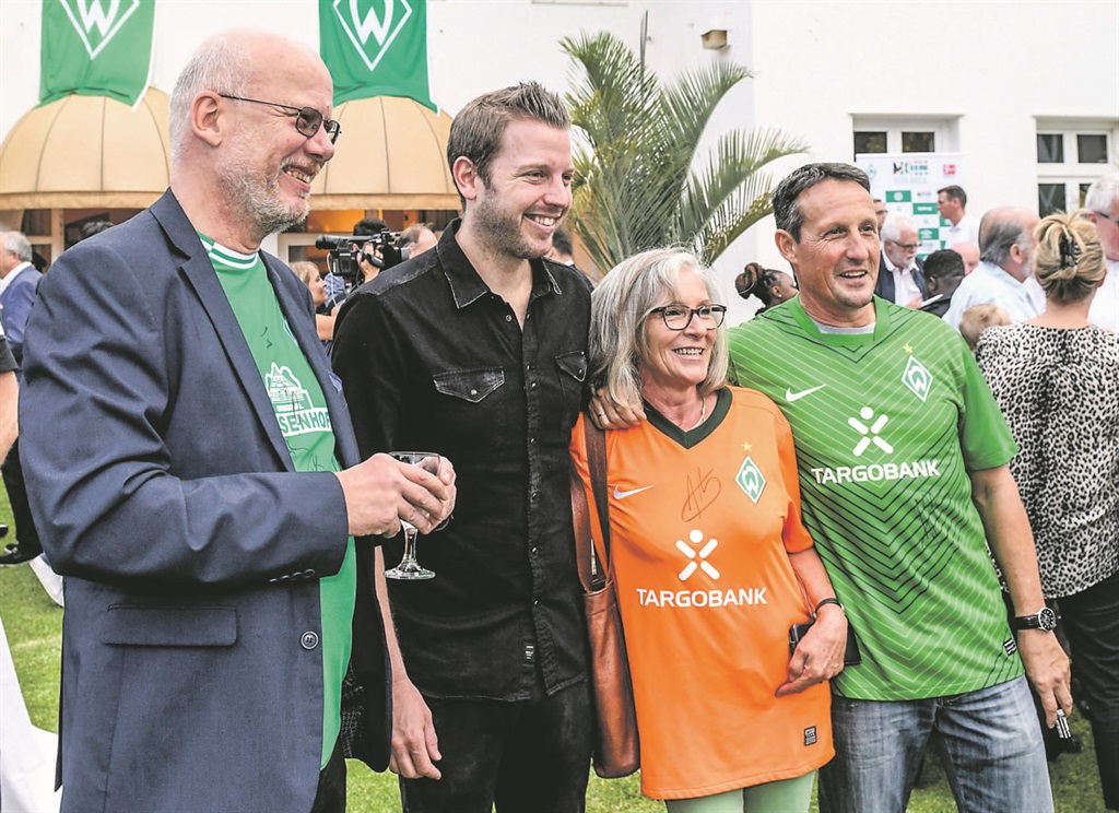 The German community at the cocktail party for the visiting Werder Bremen team, at the German Embassy. Coach Florian Kohfeldt (second left) poses with fans