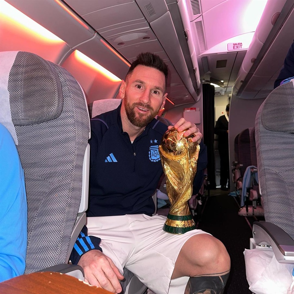 Argentine talisman and captain, Lionel Messi with the World Cup trophy.