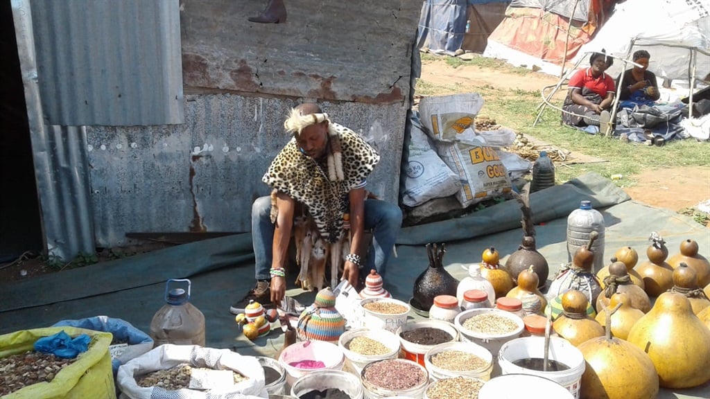 The inyanga and sangoma Jabulani Sangweni mixing his herbs at mona muthi market. Picture: Mbali Dlungwana Photo by Mbali Dlungwana