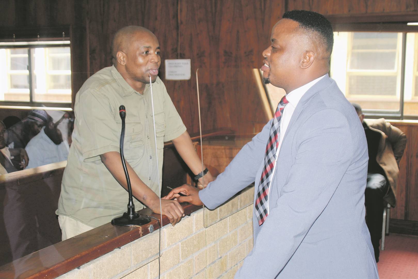 Murder suspect Philemon Lukhele with Advocate Lesego Kwakwa (right) in the Nelspruit Magistrates Court.   Photo by Bulelwa Ginindza
