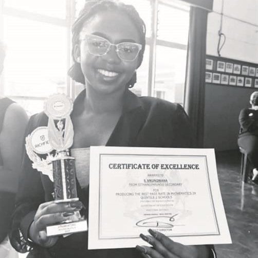 Mathematics teacher Sinovuyo Mkunqwana with an award she won last year for producing the best pass rate in mathematics in Quintile 2 schools in the Pinetown district. 