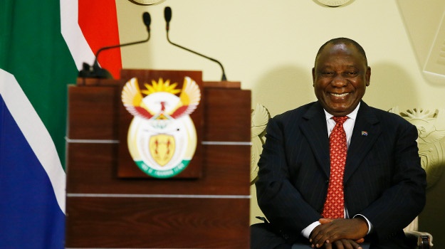 President Cyril Ramaphosa laughs as he listens to questions from journalists during a press conference outlining measures to stimulate the economy on September 21. (Phill Magakoe / AFP)