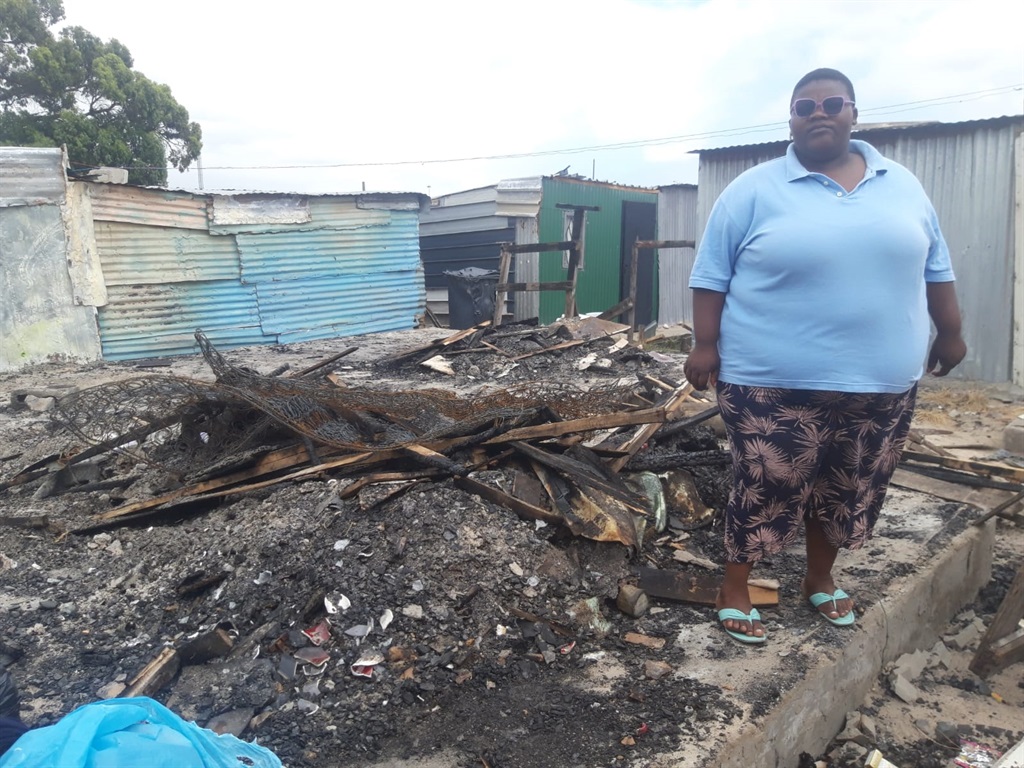 Zikhonq Ngwalase (24) stiill shocked after his boyfriend set alight her shack in Nkandla squattor camp in Philippi East Cape Town.  Photo by Lulekwa Mbadamane