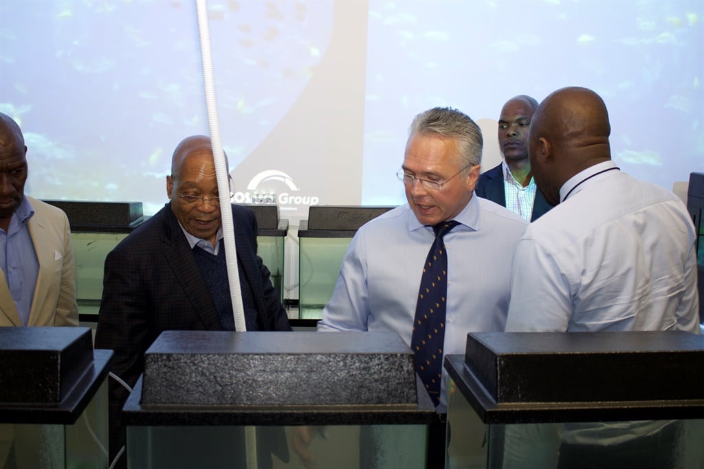 Gavin Watson leads former president Jacob Zuma on a tour of Bosasa's facililties.