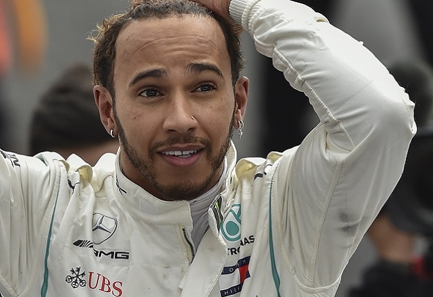 Mercedes' British driver Lewis Hamilton celebrates his fifth drivers' title after the Mexico Grand Prix at the Hermanos Rodriguez circuit. Image: AFP