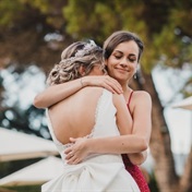 Viral video of bridesmaid holding groom's hand divides the internet but here's what really happened