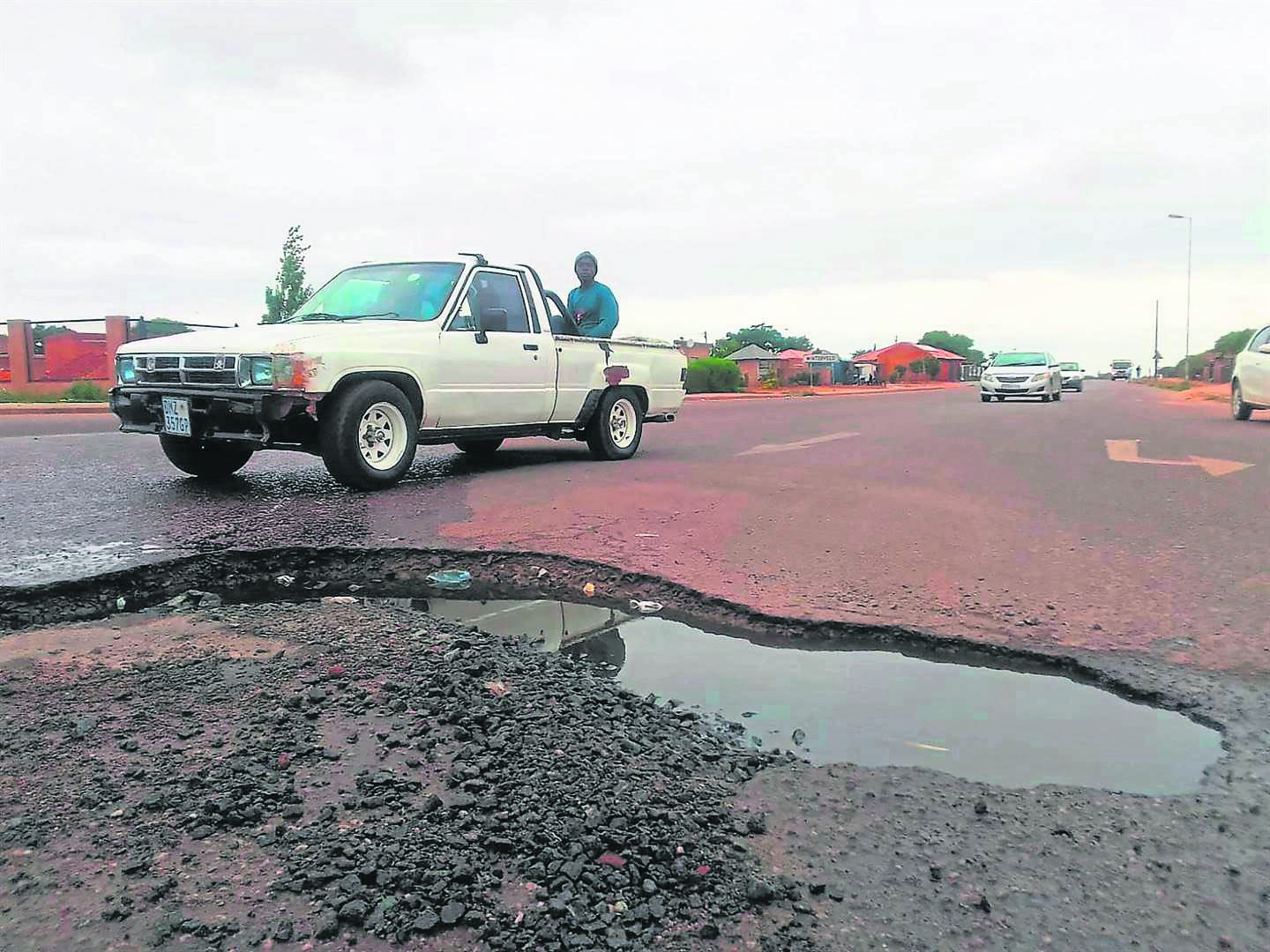 BEFORE: How the giant pothole used to look at Molefe Makinta Highway in Winterveld, Tshwane, before it was repaired.         Photos by Raymond Morare