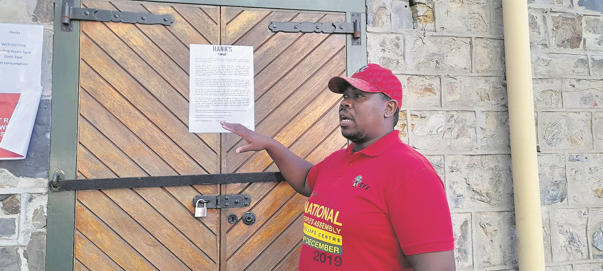 EFF members staged a picket outside a tavern that has been accused of racism in the Cape Town CBD, but found it closed. Photo by Misheck Makora 