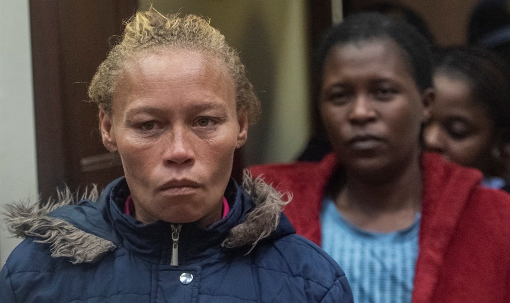 Kelly Smith and the accused entered court during the Joshlin Smith disappearance case at Vredenburg Magistrate's Court. (Brenton Geach/Gallo Images)