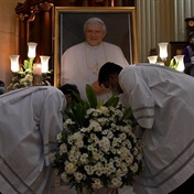 Pope Francis leads final farewell to Benedict before thousands of mourners