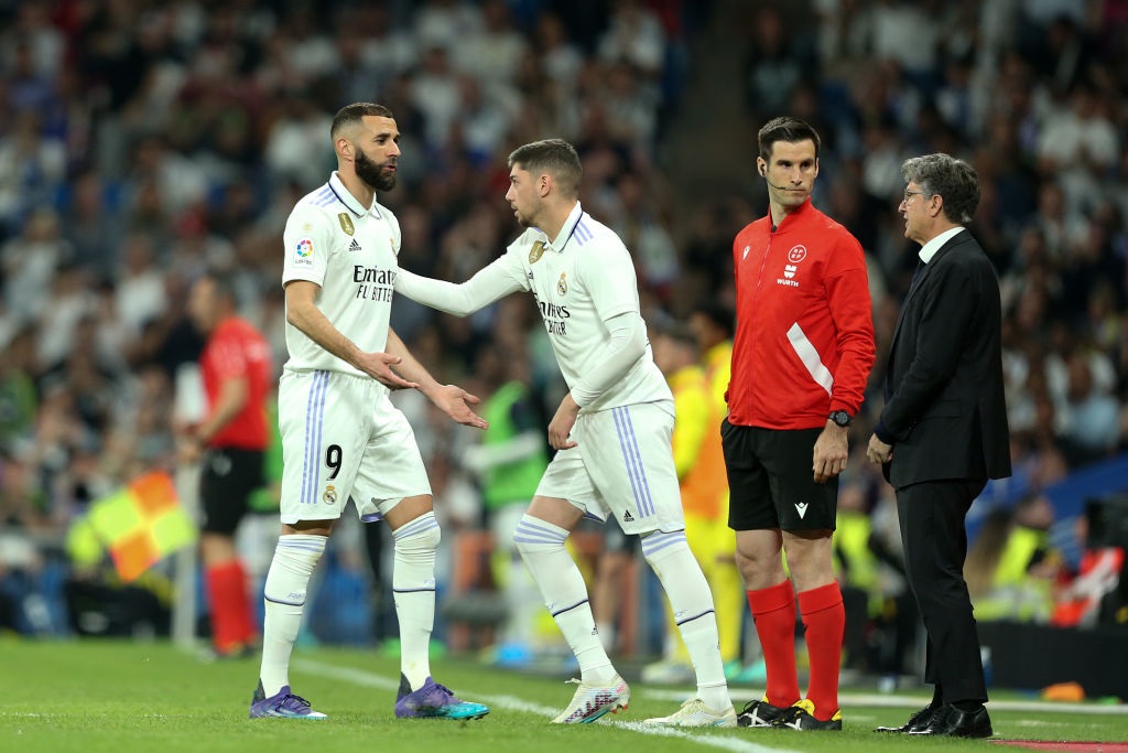 MADRID, SPAIN - APRIL 08: Karim Benzema of Real Madrid interacts with Federico Valverde of Real Madrid after being substituted off during the LaLiga Santander match between Real Madrid CF and Villarreal CF at Estadio Santiago Bernabeu on April 08, 2023 in Madrid, Spain. (Photo by Florencia Tan Jun/Getty Images)