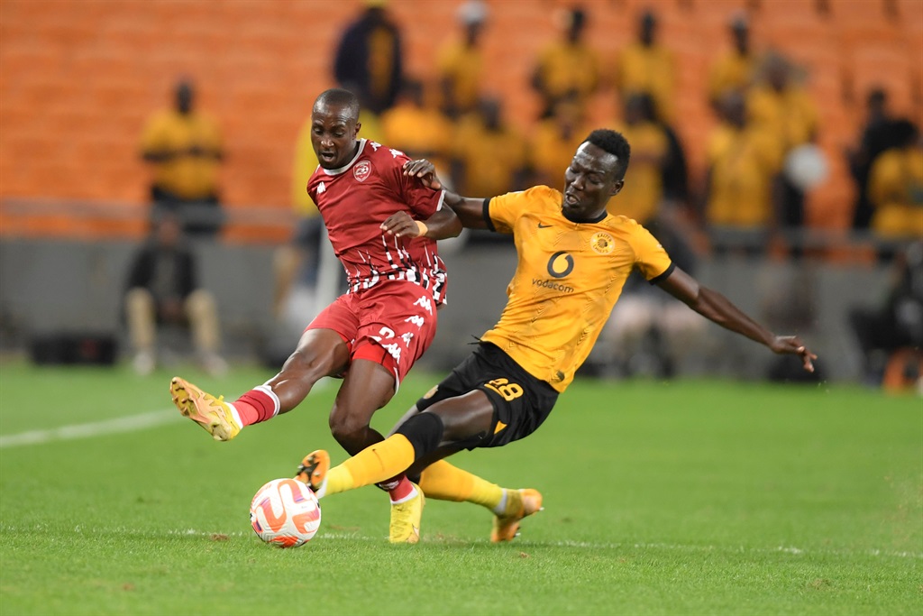JOHANNESBURG, SOUTH AFRICA - JANUARY 07: Nyiko Mobbie of Sekhukhune United is tackle by Bonfils-Caleb Bimenyimana