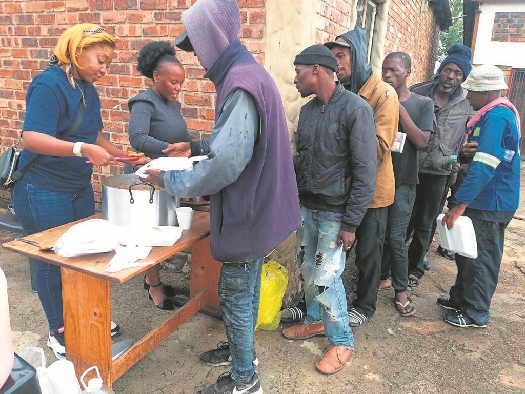 The nyaope addicts appreciate the meals they’re getting. Photo by Bongani Mthimunye
