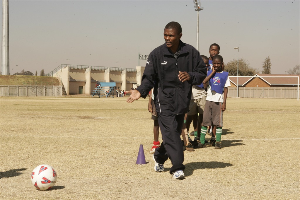 John Moeti leading training during a Laureus Sport for All programme at Huntersfield Sports Complex in Katlehong in 2005. 