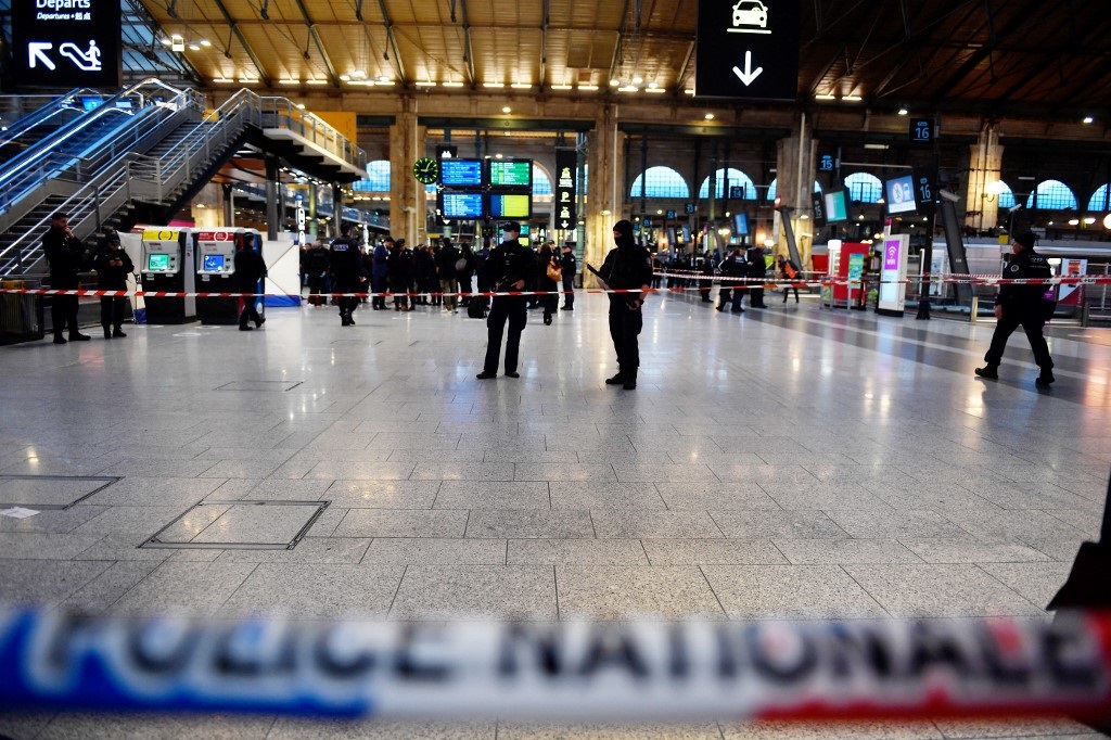 French police cordon off an area at Paris' Gare du Nord train station, after several people were lightly wounded by a man wielding a knife on 11 January 2023.