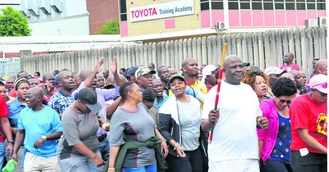 Workers protest outside the Toyota plant in Prospecton, south of Durban, over the suspension of temporary workers.