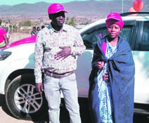Matshoboko Makola and his daughter, Motsatsi, stand in front of her brand new car.       Photo by Judas Sekwela 