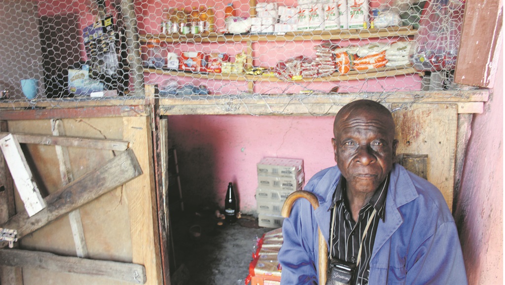 Madala Tuna Nomqonde at the spaza where he lost three children in an armed robbery. Photo by Yola Kambile
