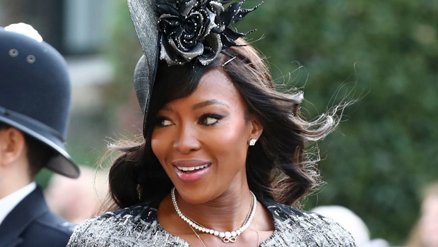 Naomi Campbell walked in looking amazing in a black fascinator