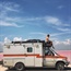 Man who nearly died travels the world – in an ambulance