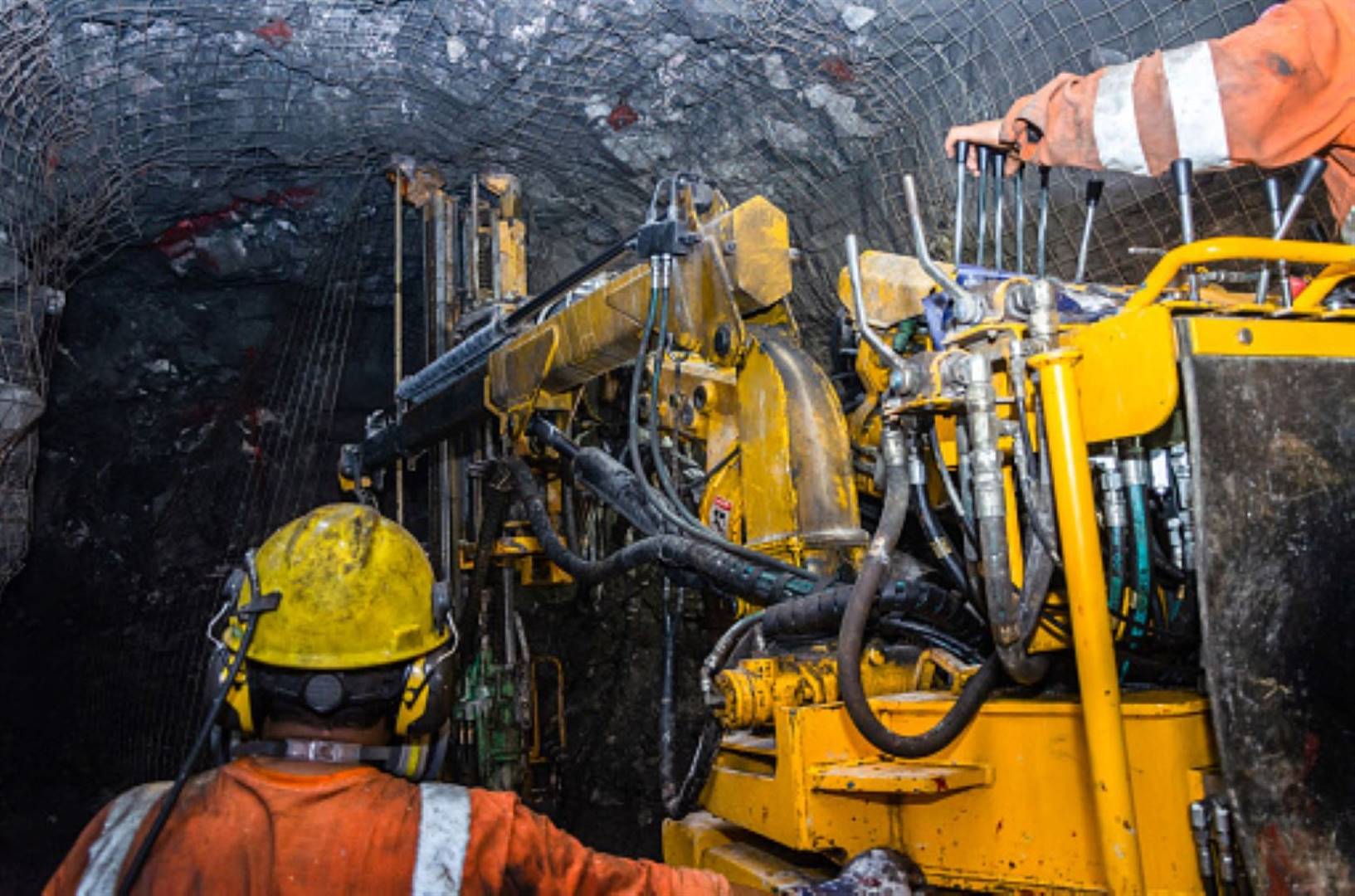 Mining operator on mining machine, underground mining meshPhoto: istockphoto