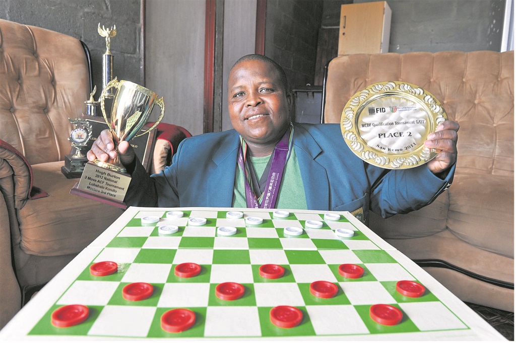 Draughts champion Lubabalo Kondlo empowers others despite lack of funds. Picture: Werner Hills