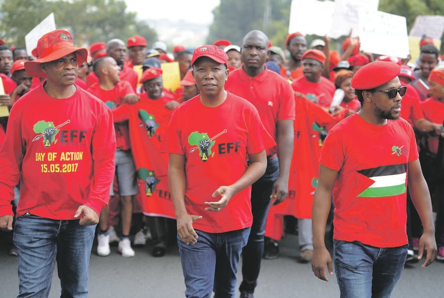 STRENGTH IN NUMBERS EFF leader Julius Malema (centre) and national spokesperson Mbuyiseni Ndlozi lead party members during a protest march. The EFF is determined to attract a 9 million-strong voter base for next year’s elections. Picture: Felix Dlangamandla