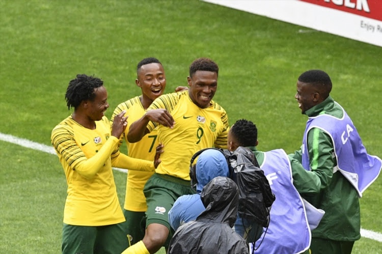 Lebo Mothiba of South Africa celebrates scoring a goal with Percy Tau