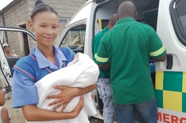 Marelize Perry holds the baby she helped deliver. (PHOTO: Supplied)