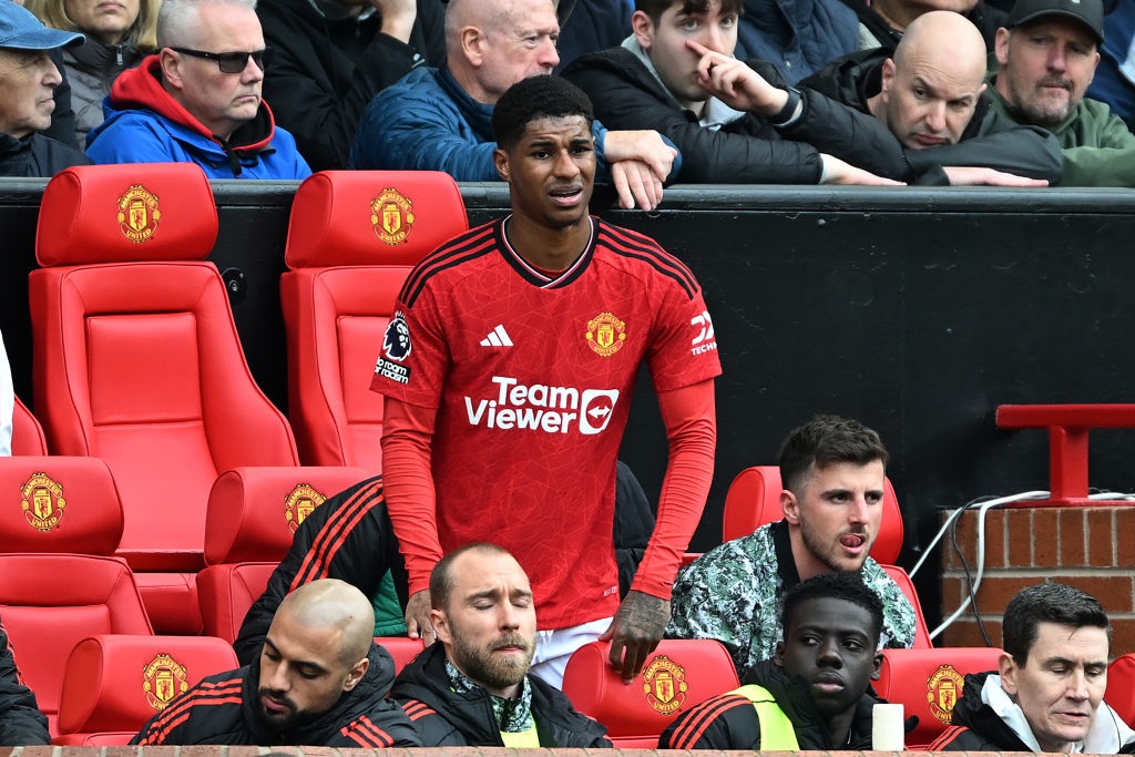 MANCHESTER, ENGLAND - APRIL 07: Marcus Rashford of Manchester United looks on from the dugout after being substituted off during the Premier League match between Manchester United and Liverpool FC at Old Trafford on April 07, 2024 in Manchester, England. (Photo by Michael Regan/Getty Images)
