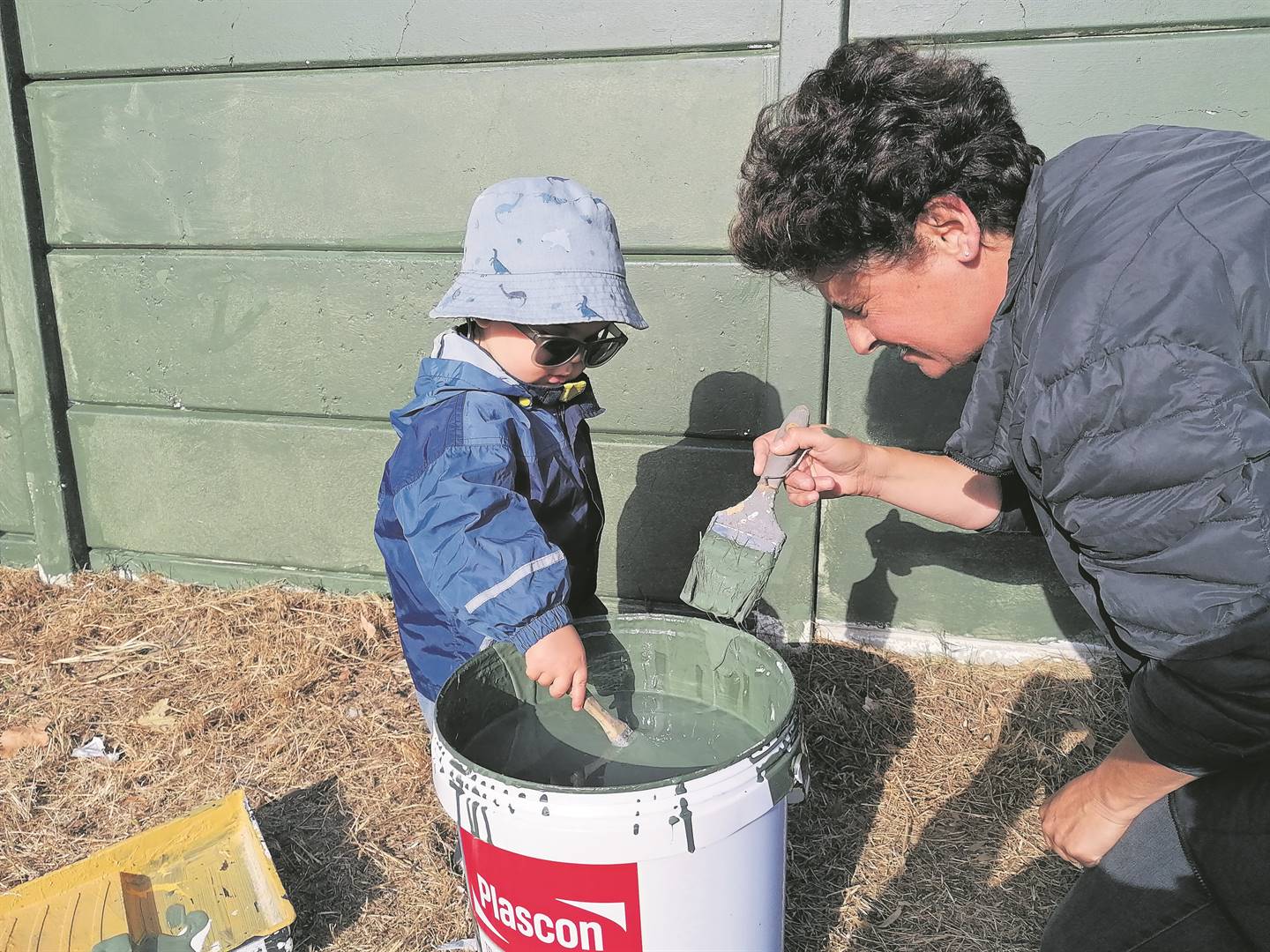In restoring dignity to the Batavia Special Needs School, many other residents offered a hand to help with painting, including the 20-month-old Lio Schablitzky here with Taheera Shaboodien, as well as a 12-year-old girl.PHOTOS: Supplied