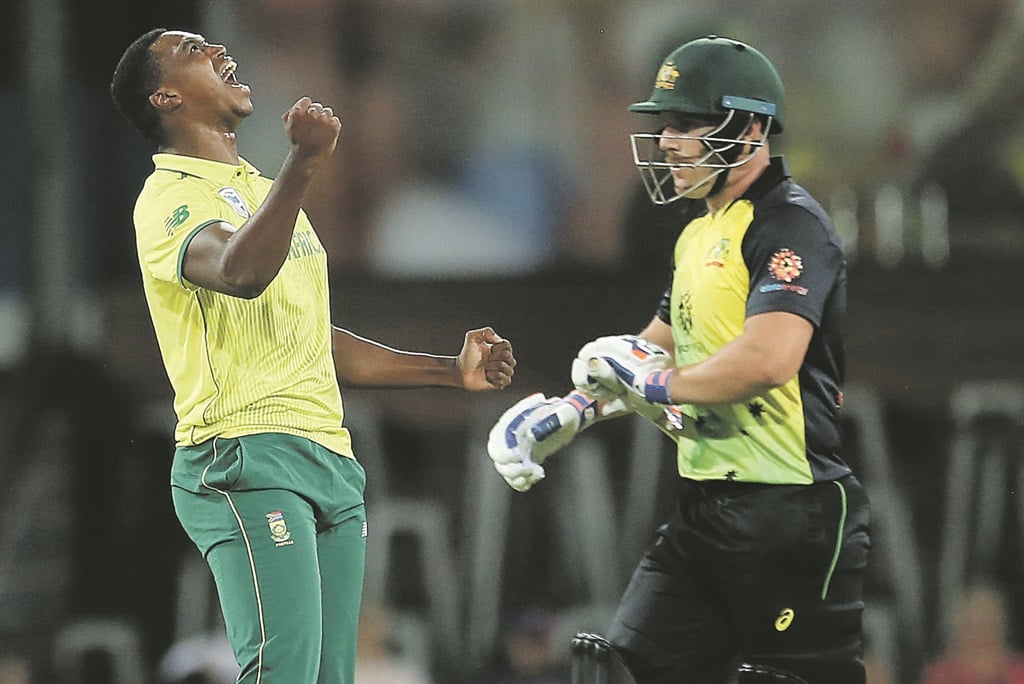 SWEET VICTORY Lungi Ngidi (left) celebrates taking Aaron Finch’s wicket during their T20 match at Metricon Stadium yesterday. Picture: Getty Images