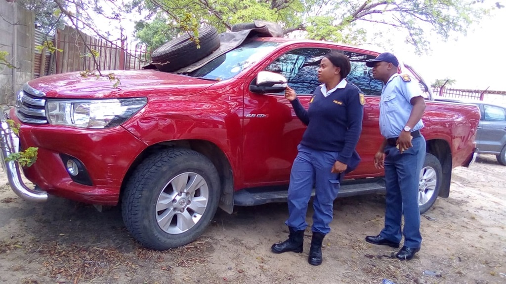 Constable Mxolisi Ndlovu and Constable Dudu Mkhari are inspecting the damaged belonging to murdered ex-teacher, Caiphus Chiloane.Photo by 