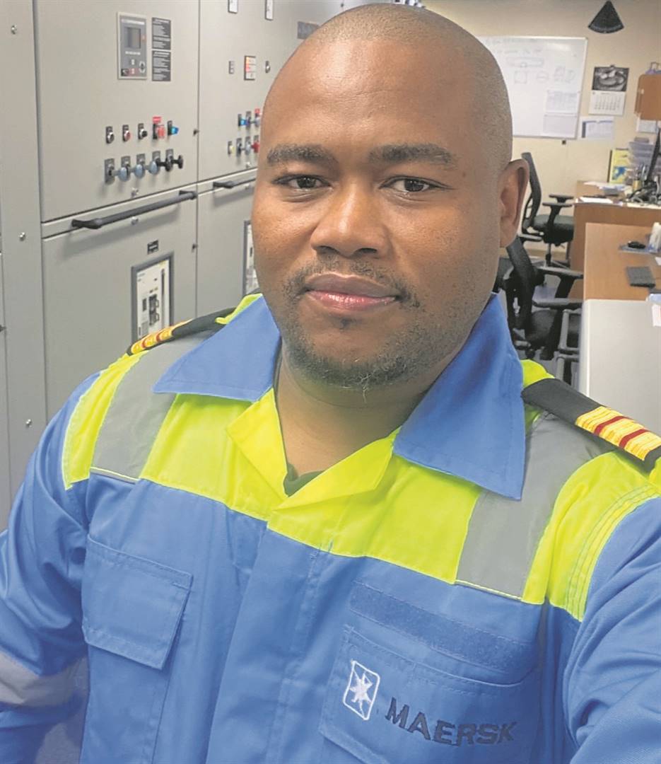 < Sivuyile Fisa is the first scholarship ‘student’ to be studying - online and while on board – for an MSc in Marine Engineering Management through the Business College of Athens.  Photo: Supplied