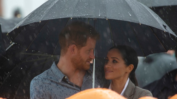 Prince Harry and Meghan Markle share a sweet moment in the rain