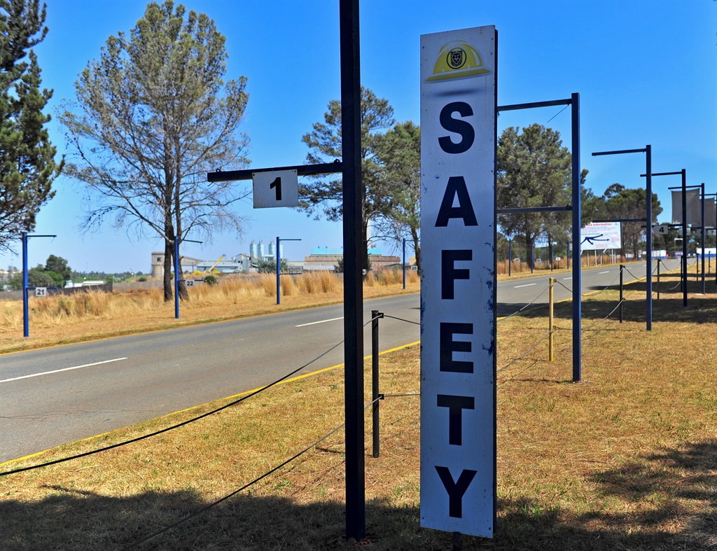 The flags representing safety performance and production performance on the side of the road at South Deep gold mine. Picture: Tebogo Letsie/City Press