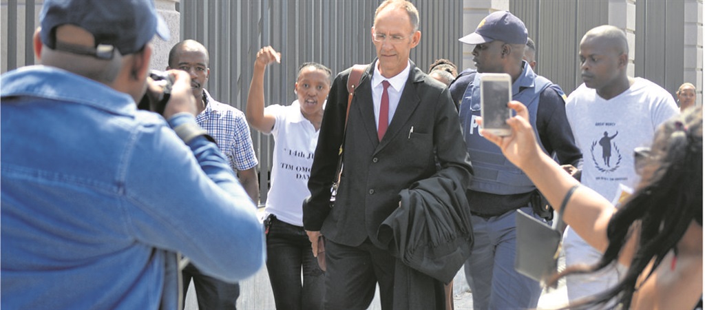 Timothy Omotoso’s lawyer Peter Daubermann was confronted by a group of women as he was leaving the Port Elizabeth High Court on Wednesday. Photo by Luvuyo Mehlwana
