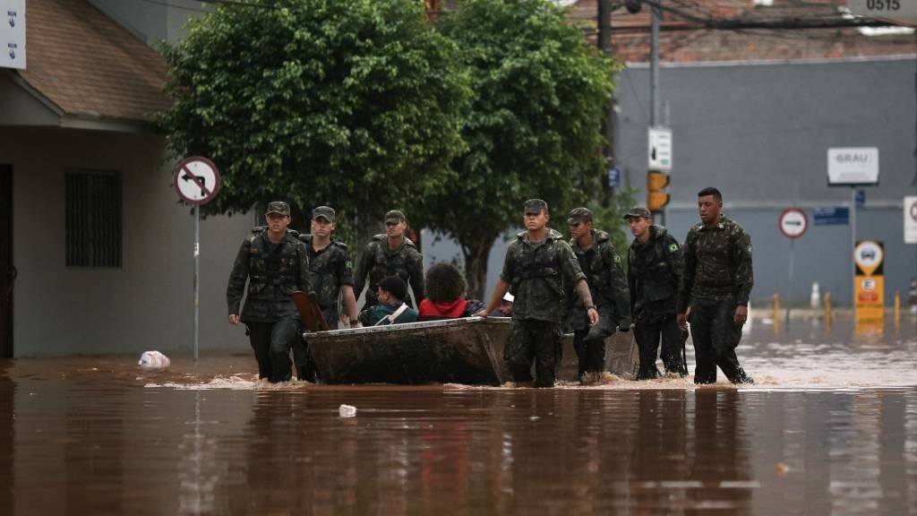 Military members work in a flooded street in São Geraldo neighbourhood in Porto Alegre, Rio Grande do Sul State, Brazil. (Anselmo Cunha/AFP)