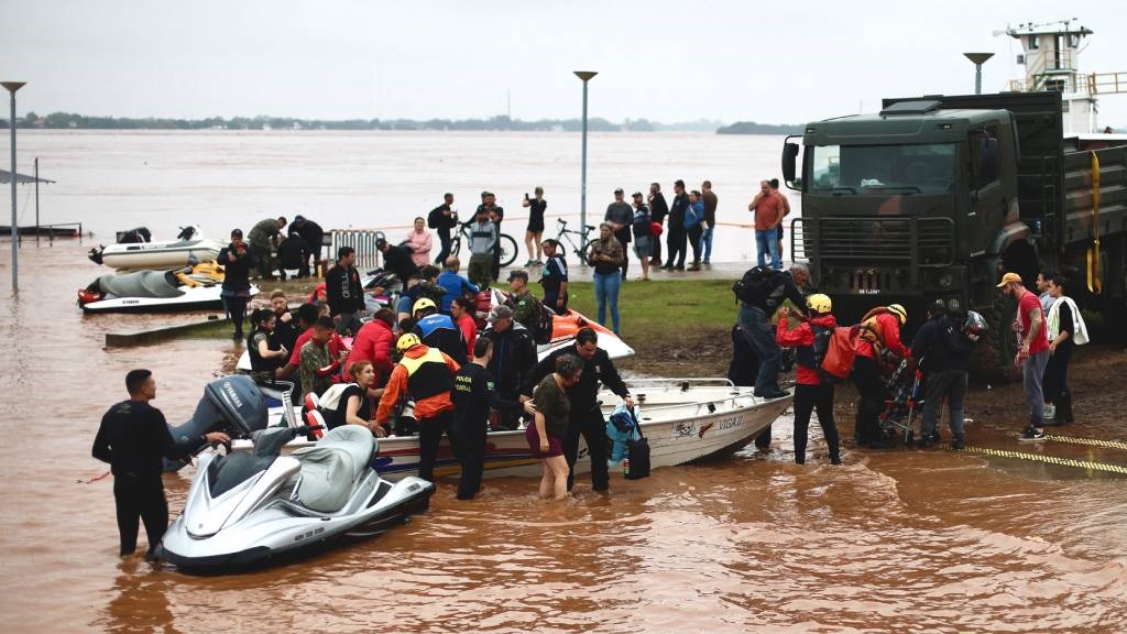 Rescue teams set up a base on the banks of the Gua