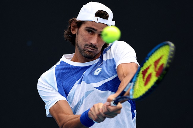 Lloyd Harris in action at the Australian Open. (Photo by Martin Keep/AFP)