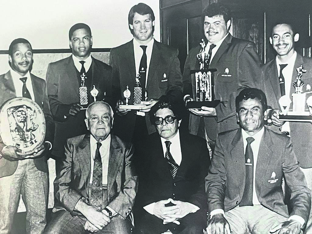 At the presentation of trophies in 1990 of the Western Province League after they won the Sport Pienaar Trophy are back from left: Wilfred Cupido, Allen Erasmus, Bryn Morse, Paul Carstens and Quinton Daniels. In front: Doc Danie Craven, Cmdt John Cupido and Dougie Dyers.
