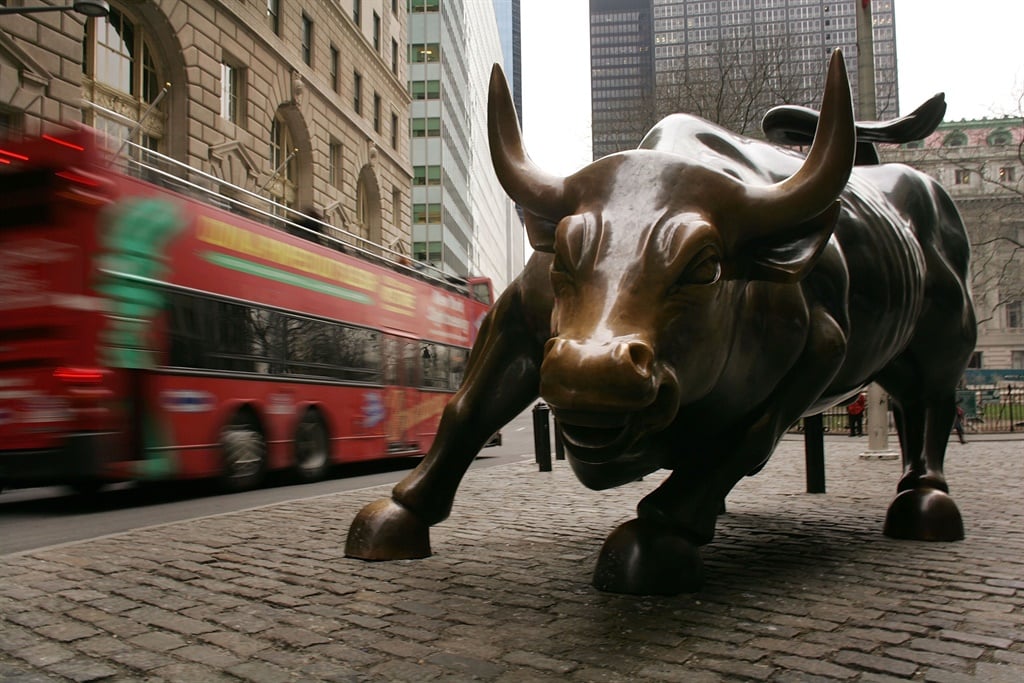 The iconic statue of a bull in Wall Street in the financial district of New York.